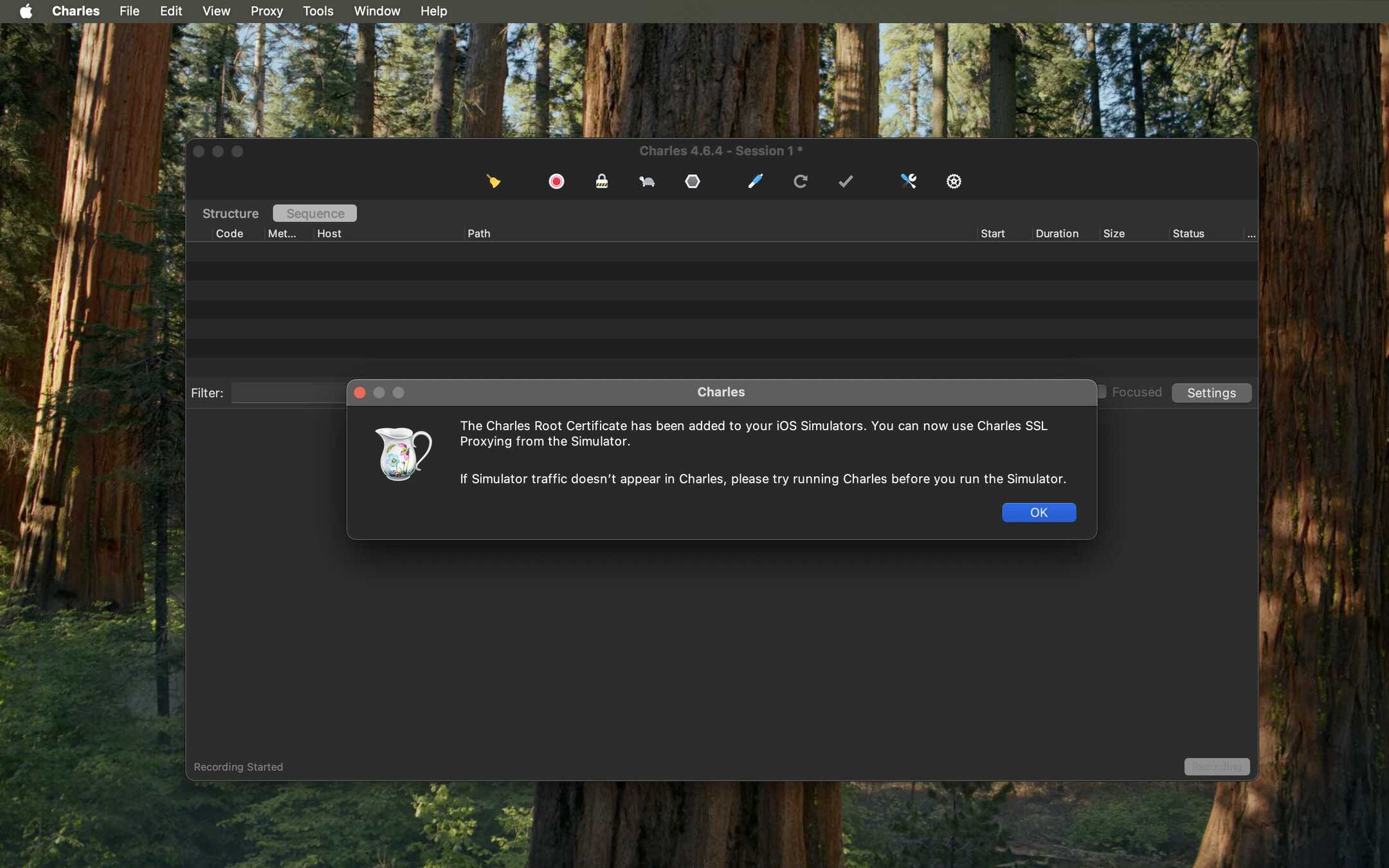Charles popup confirming certificate installation on the simulator.